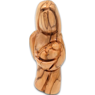 Handcrafted olive wood angel figurine cradling baby Jesus, carved by artisans in Bethlehem, Holy Land.