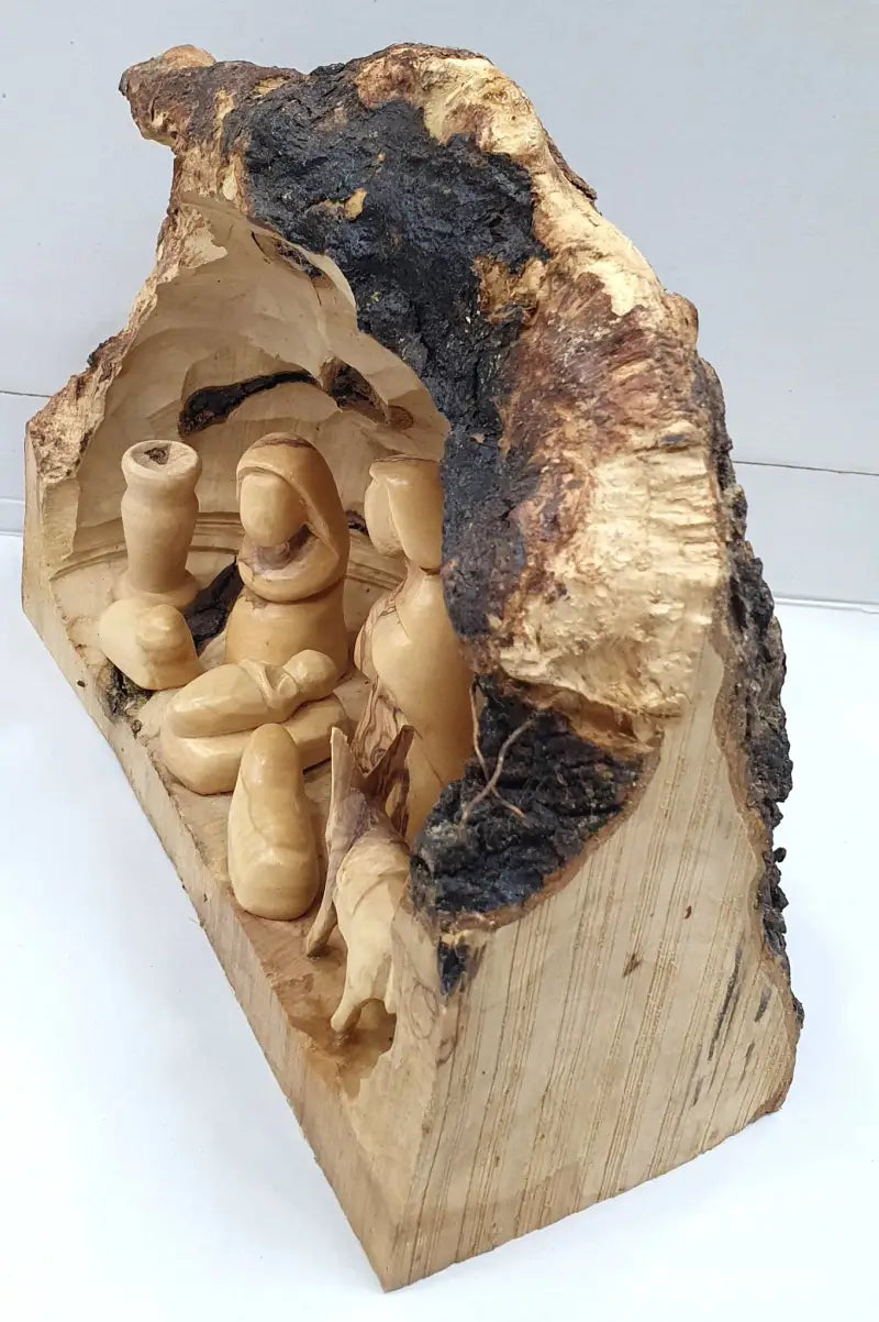Hand-crafted nativity cave featuring the holy family from bethlehem - nativities