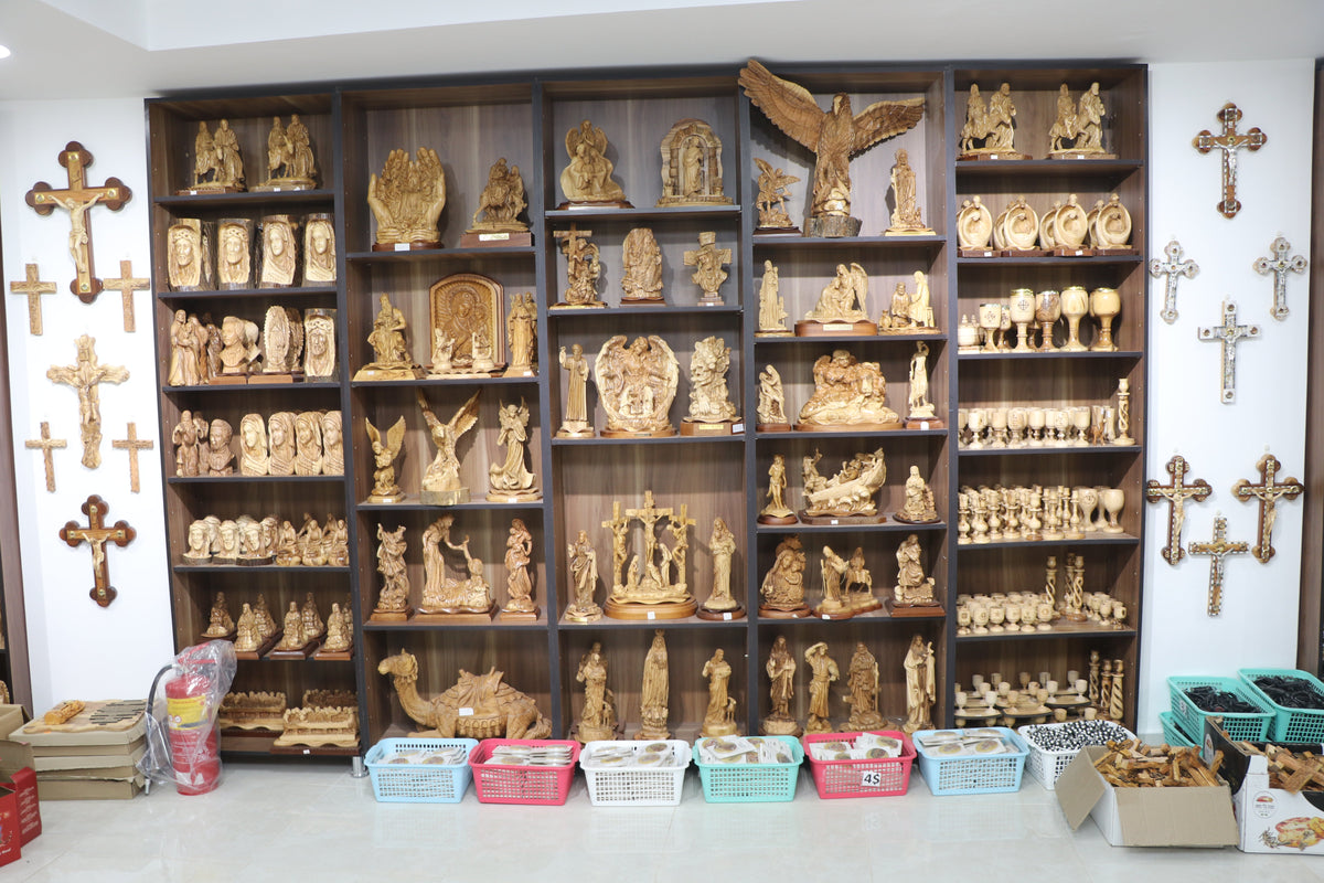 Bethlehem shop display with olive wood Christian gifts, crosses and religious statues