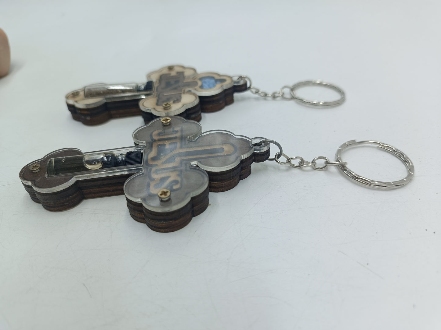 Set of 2 Holy Land Keychains – Wooden Cross with JESUS Design | Containing Holy Earth & Oil