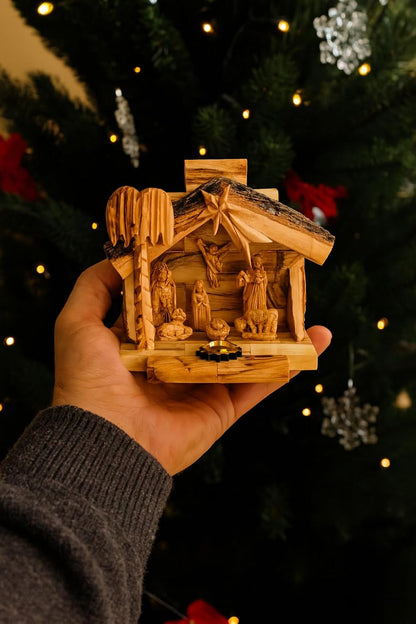 NAT022 small Bethlehem Nativity held in a hand to show its scale