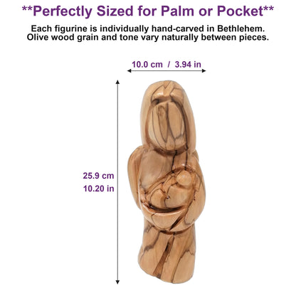 Olive wood angel figurine resting in an open palm, showing its compact hand-sized scale, made in Bethlehem.