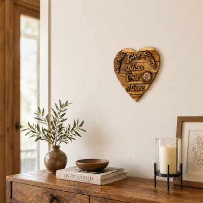Olive wood God Bless Our Home heart plaque lifestyle scene with olive branch and candle, Bethlehem