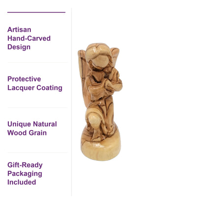 Close-up of Bethlehem olive wood angel showing unique grain patterns, lacquer coating, and authentic artisan carving detail.