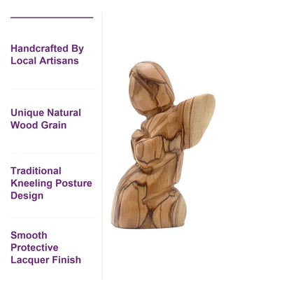 Close-up of the kneeling angel figurine's hand-carved olive wood grain, highlighting the unique natural patterns crafted by Bethlehem artisans.