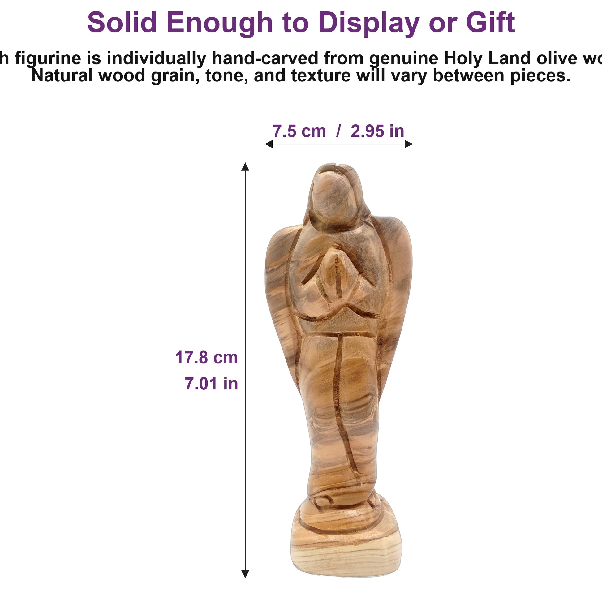 7-inch solid olive wood angel figurine shown next to a hand, highlighting its substantial, weighty craftsmanship from the Holy Land.