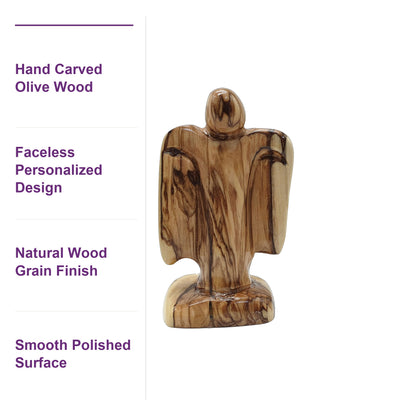 Close-up of the natural olive wood grain on this hand-carved Holy Land angel, unpainted and authentic.