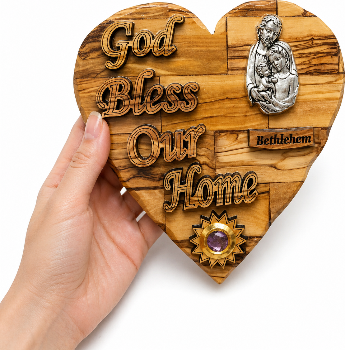 Olive wood Holy Family heart plaque shown held in hand for size reference, Bethlehem