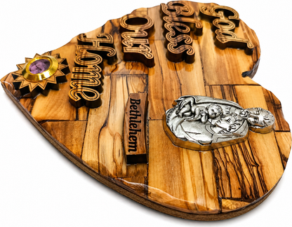 Olive wood Holy Family heart plaque side angle showing pewter medallion and frankincense capsule depth, Bethlehem