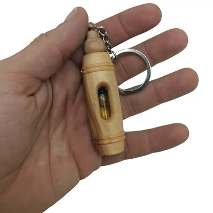Handcrafted olive wood keychain with encased pure oil – unique and symbolic gift keychain