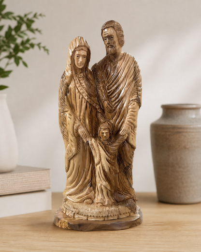 Large Bethlehem Holy Family carving displayed beside simple home decor
