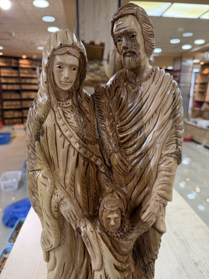 Close view of Mary Joseph and the carved robes on the Holy Family sculpture