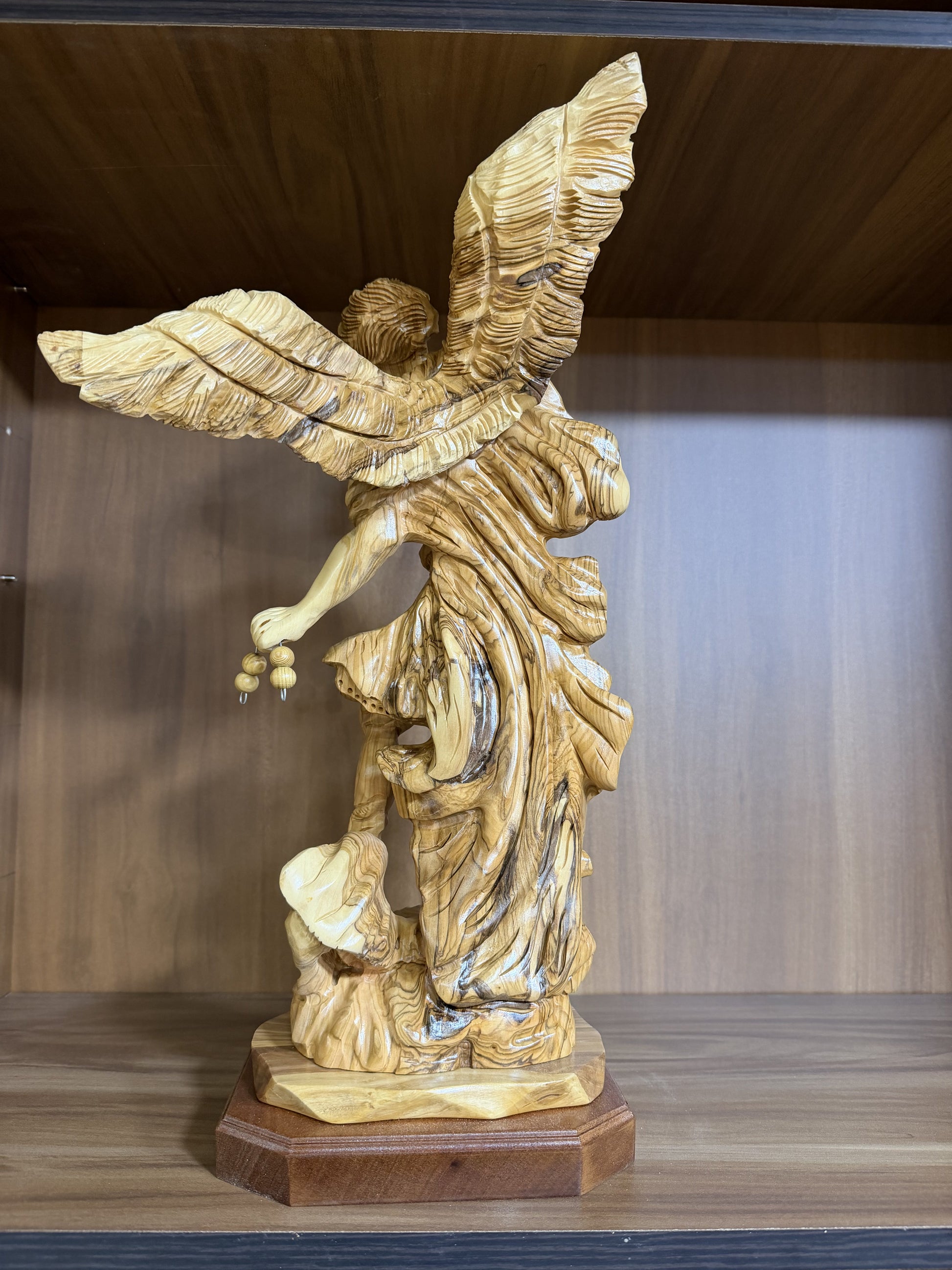 Carved victory scene at the base of the St. Michael Archangel statue