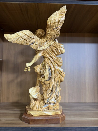 Carved victory scene at the base of the St. Michael Archangel statue