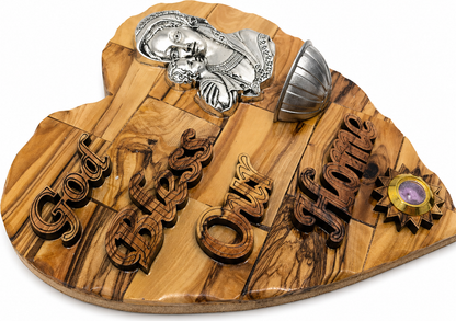 Olive wood grain detail of Madonna and Child heart plaque showing organic figure variation, Bethlehem