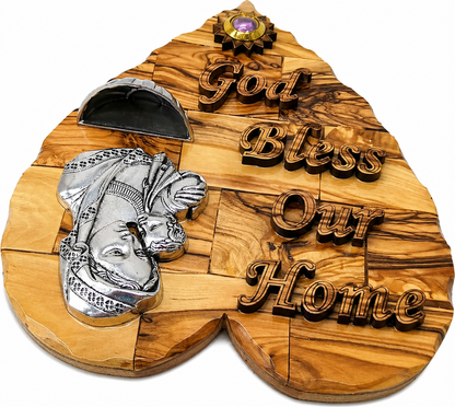Olive wood Madonna and Child heart plaque shown held in hand for size reference, Bethlehem