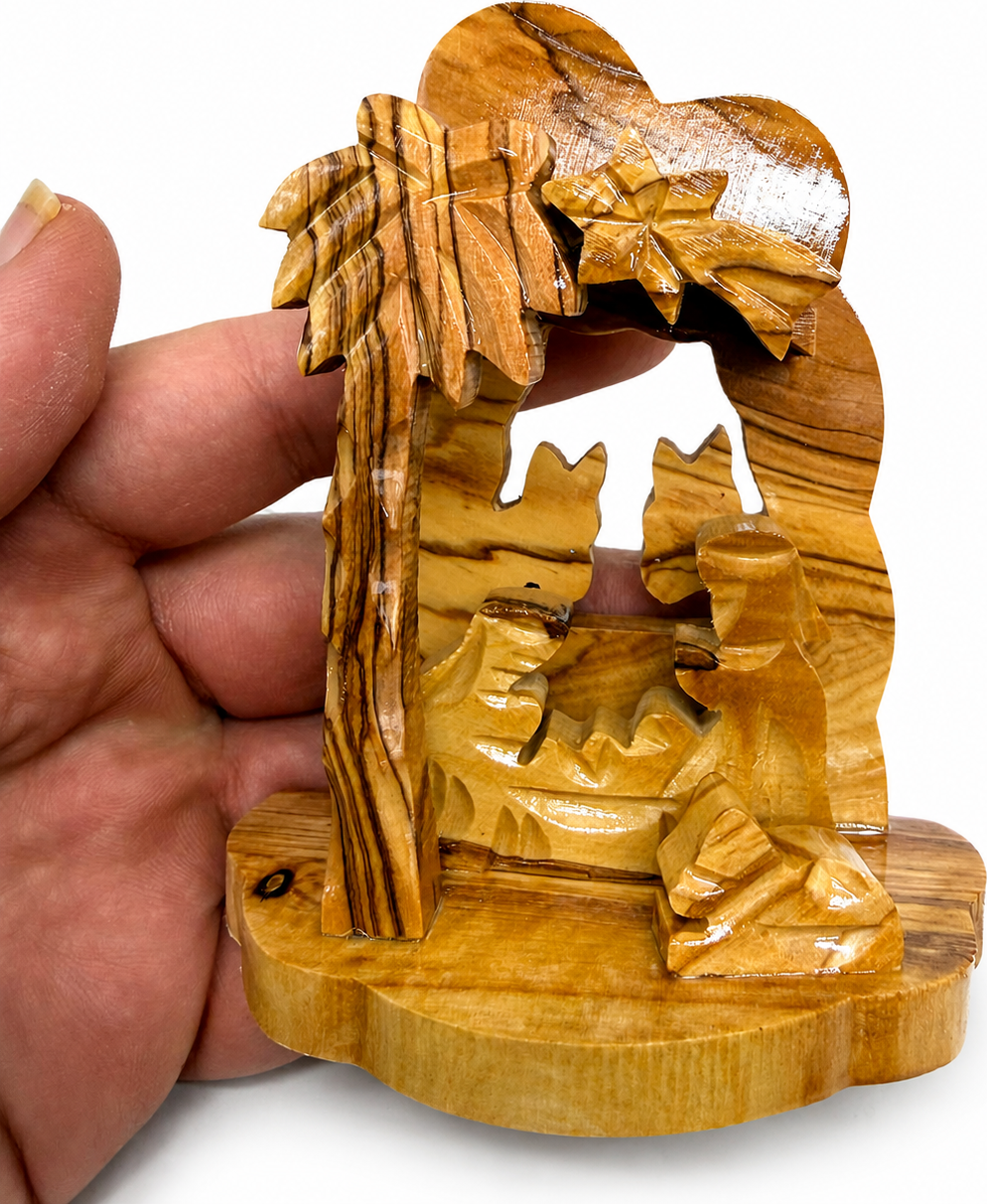 Mini Nativity Set held in hands to show size, hand carved olive wood from Bethlehem