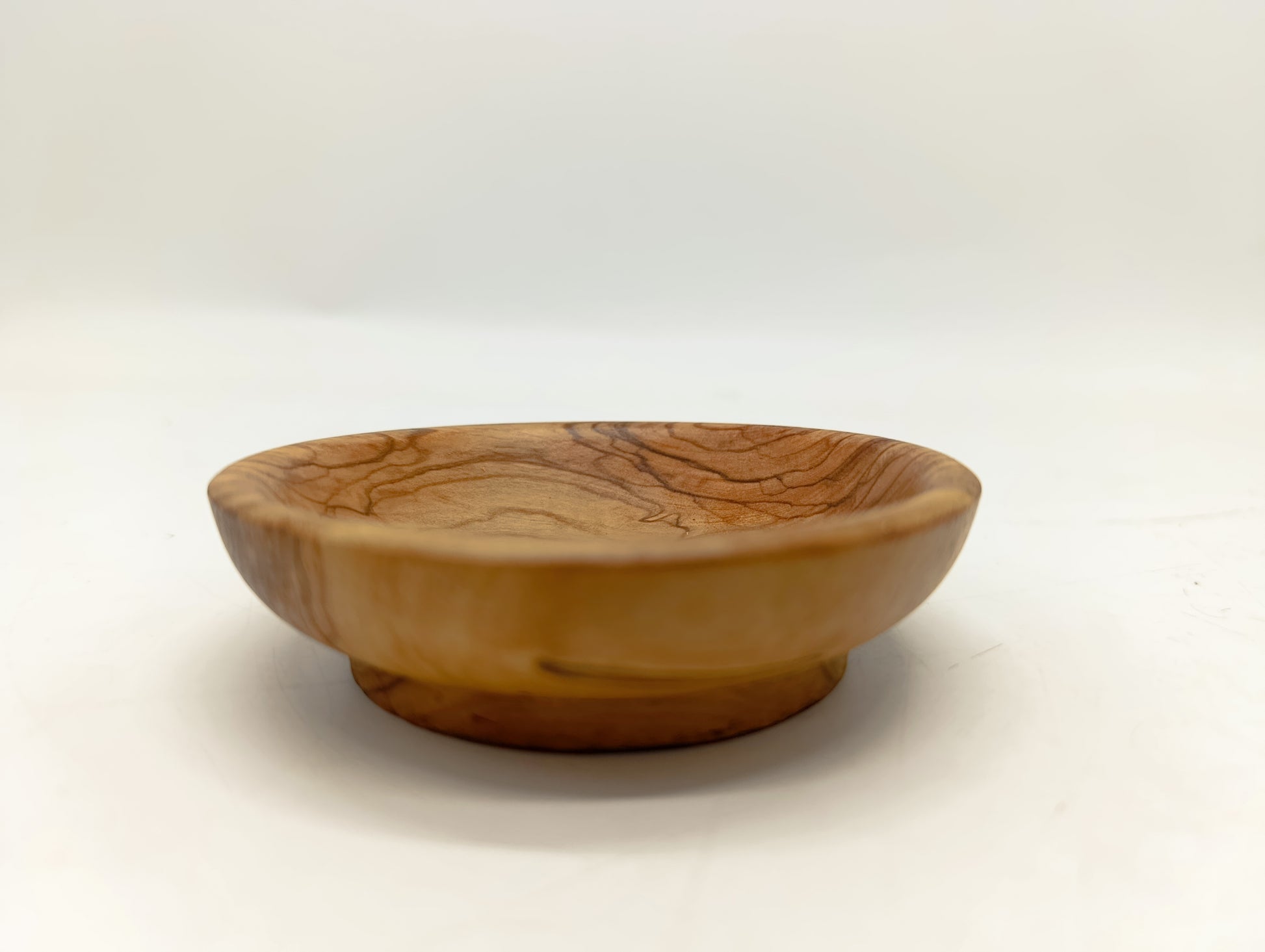 Olive wood olive wood communion bread tray in hand size view from Bethlehem Holy Land