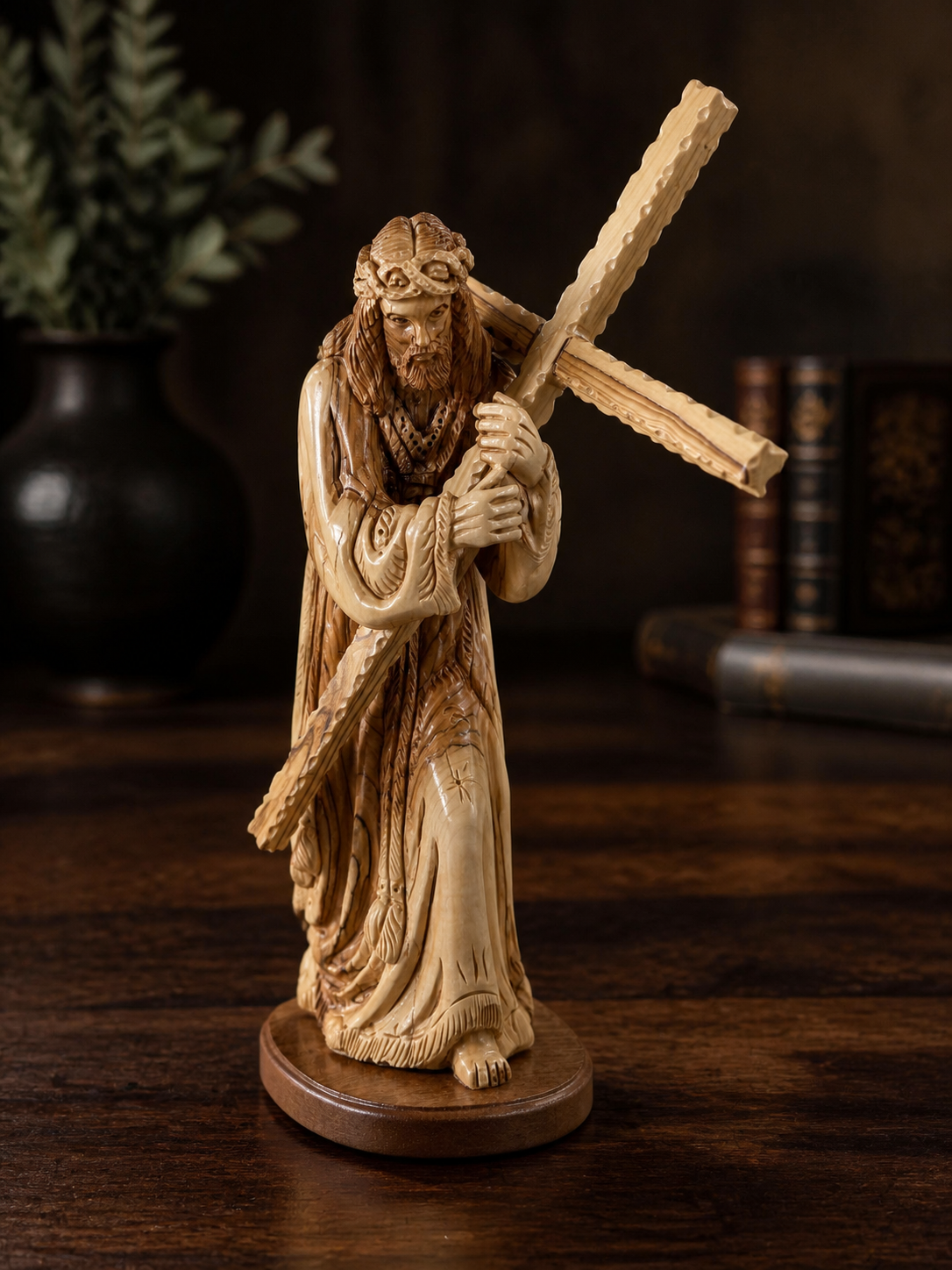 Bethlehem olive wood Jesus sculpture displayed in a dark study setting