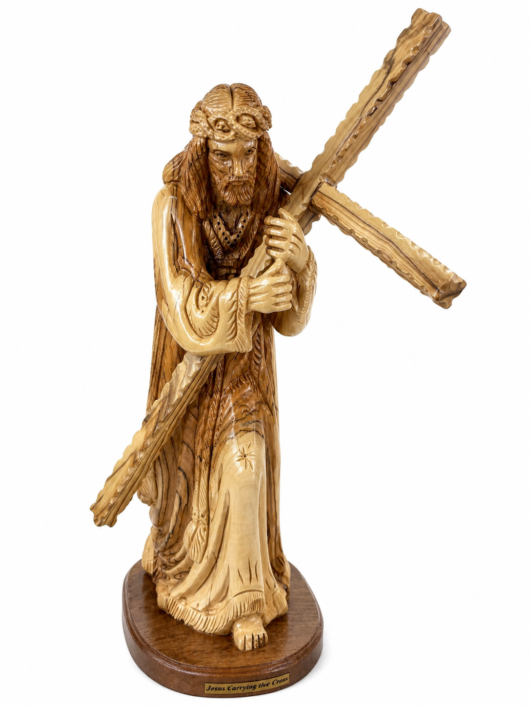 Olive wood Jesus carrying the cross statue from Bethlehem on a white background