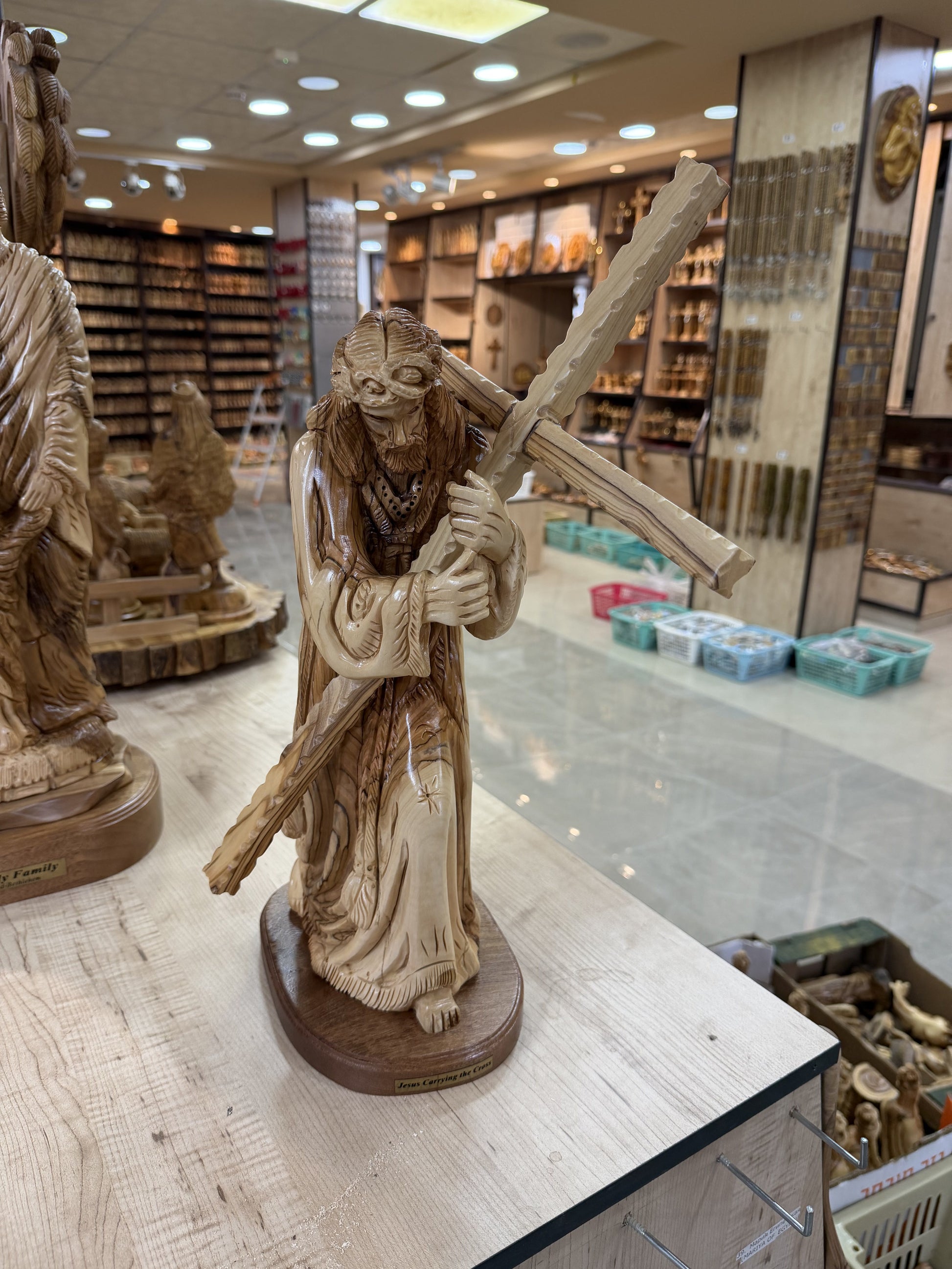 Workshop front view of the Jesus carrying the cross olive wood carving