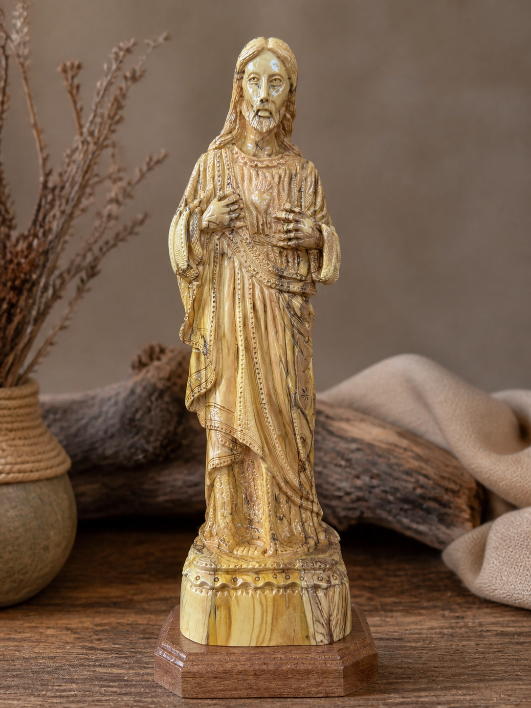 Sacred Heart of Jesus carving displayed in a rustic Bethlehem inspired setting