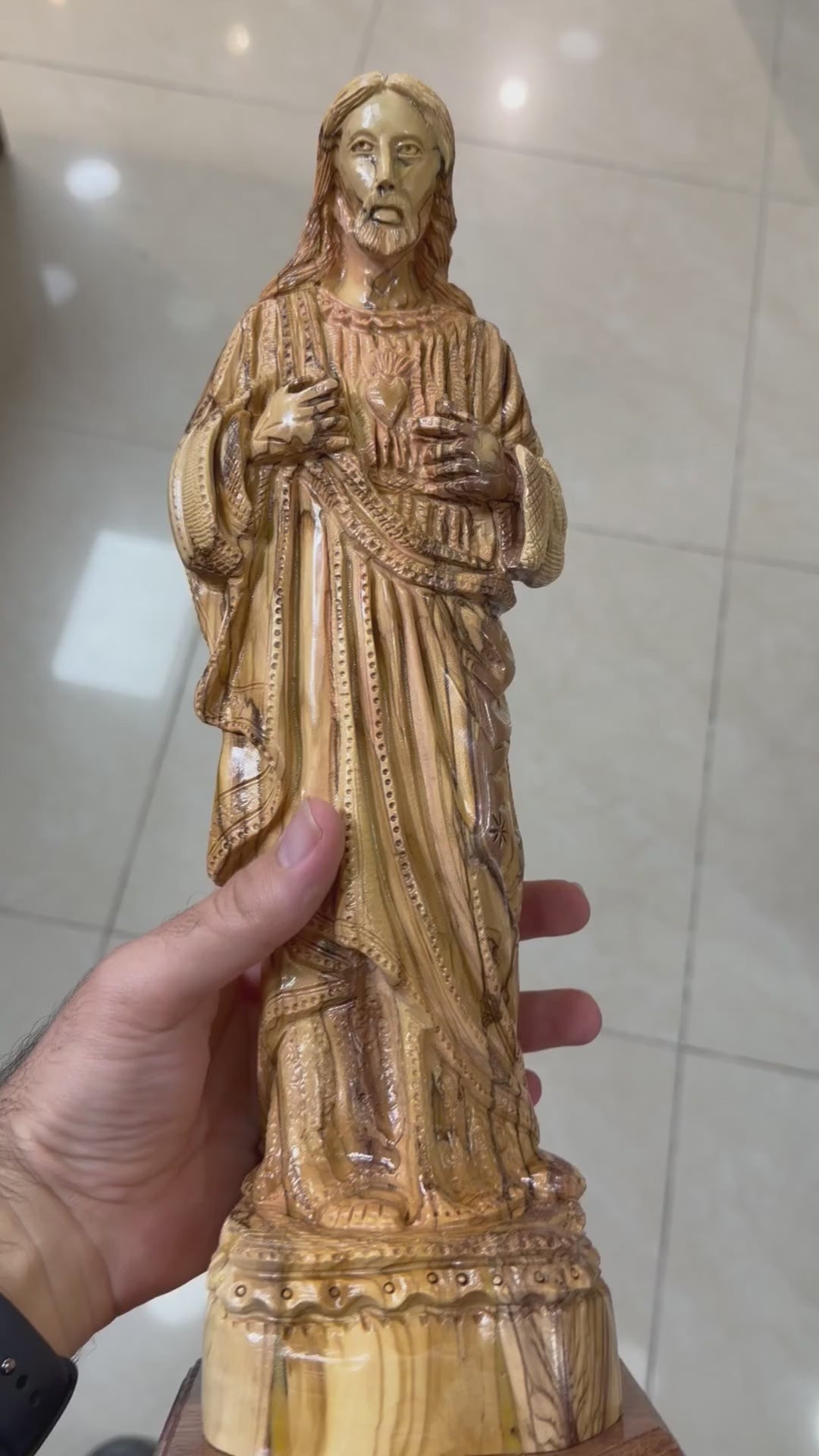 Olive wood Sacred Heart of Jesus statue from Bethlehem shown in a short workshop video