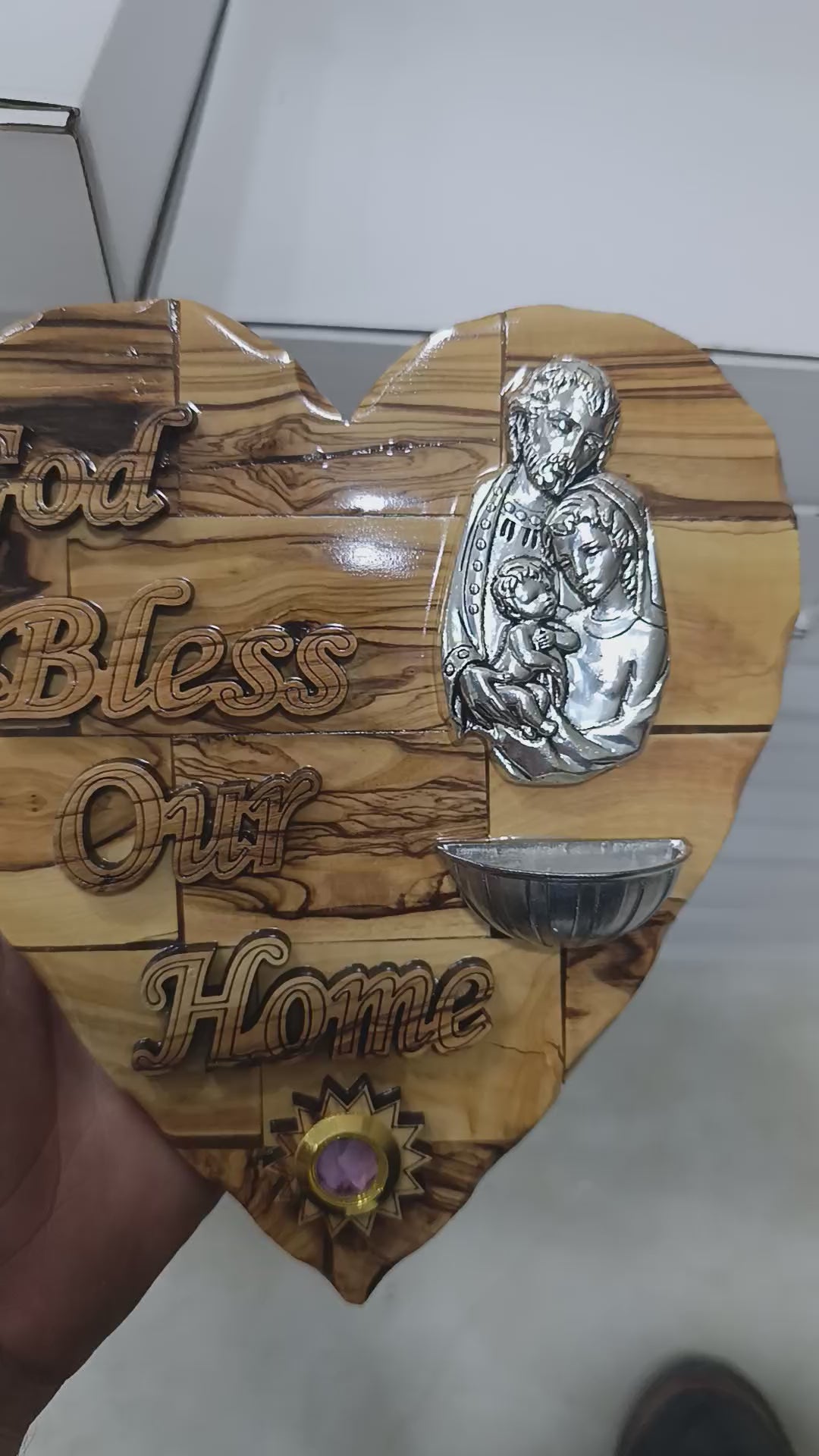 Olive wood Holy Family heart plaque from Bethlehem rotating to show holy water font and grain