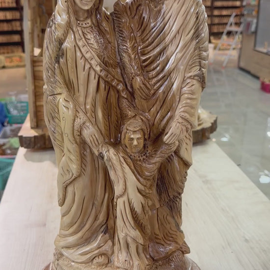 Large olive wood Holy Family statue from Bethlehem shown in a short workshop video