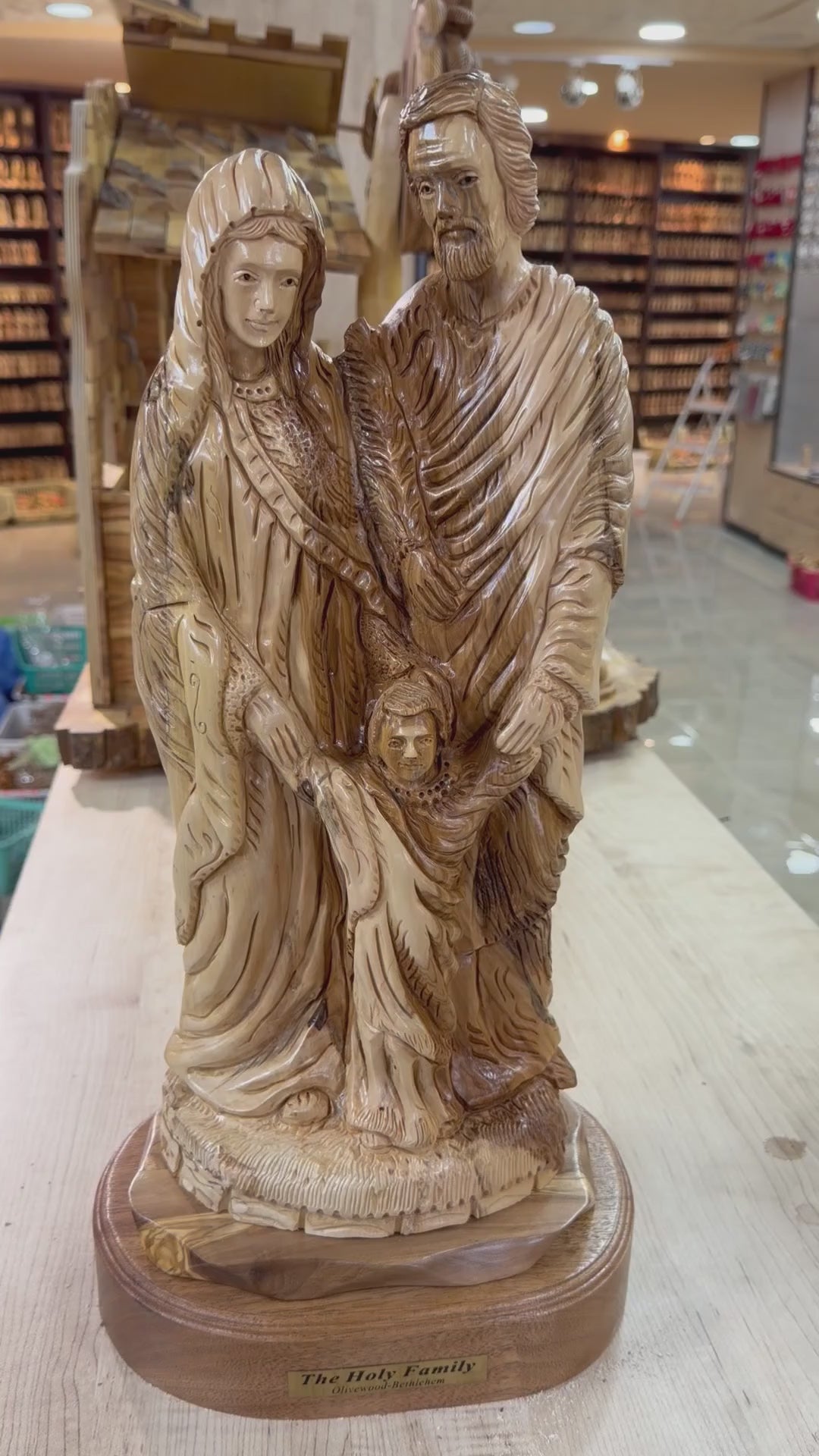 Large olive wood Holy Family statue from Bethlehem shown in a short workshop video