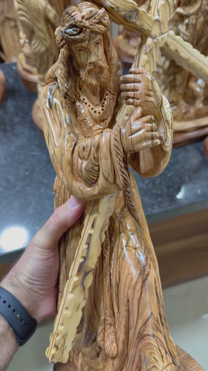 Olive wood Jesus carrying the cross statue from Bethlehem shown in a short workshop video
