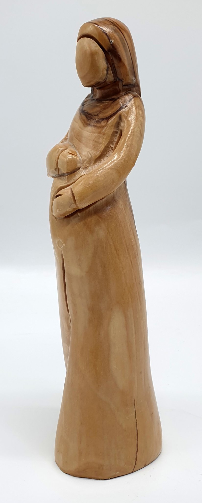 A testament to the Blessed Mother carrying Baby in her womb. This exquisite 8-inch masterpiece is meticulously handcrafted in Bethlehem by Zuluf artisans - Zuluf